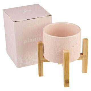 MACETA COLOR ROSA CON BASE EN BAMBOO